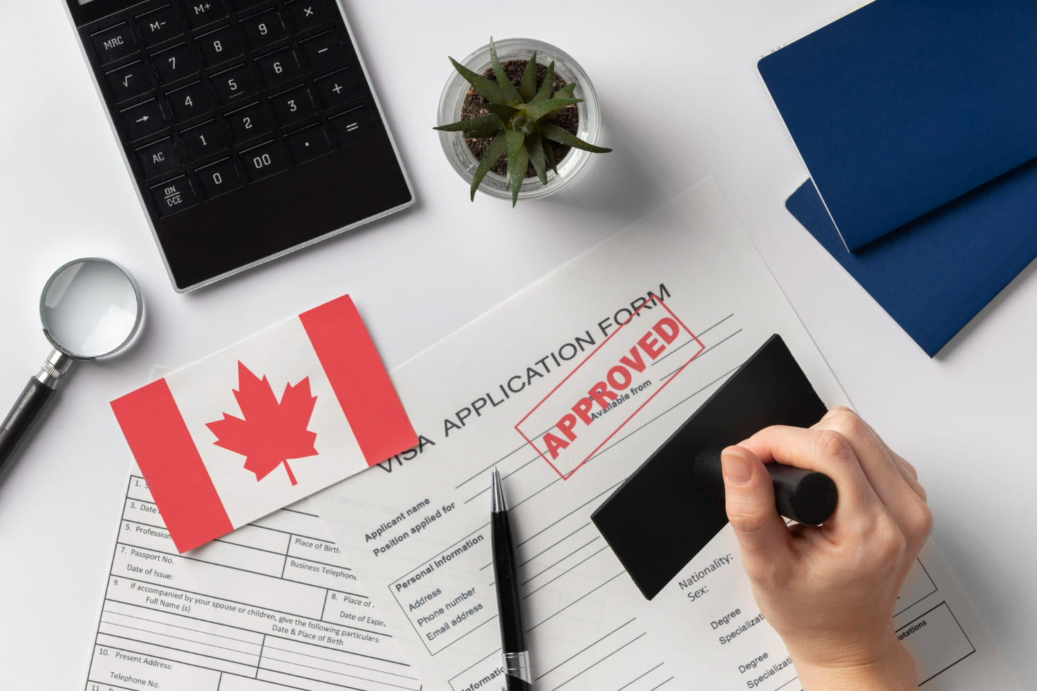 Types of Canadian Visas for Indians. Approved stamp on Visa documents with Canadian Flag.